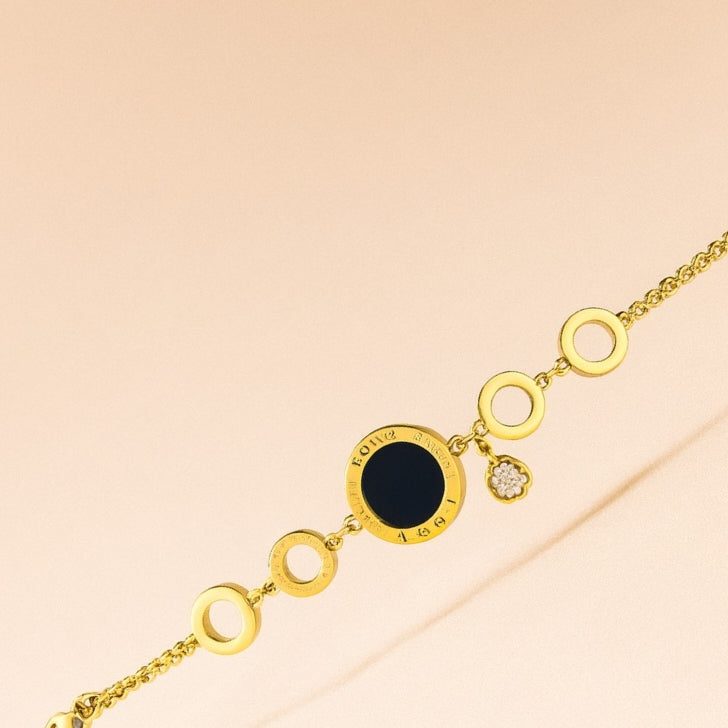 1. Gold Circle Link Bracelet with Black Enamel & Charm