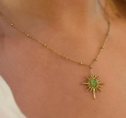 Gold Sunburst Pendant Necklace with Green Stone